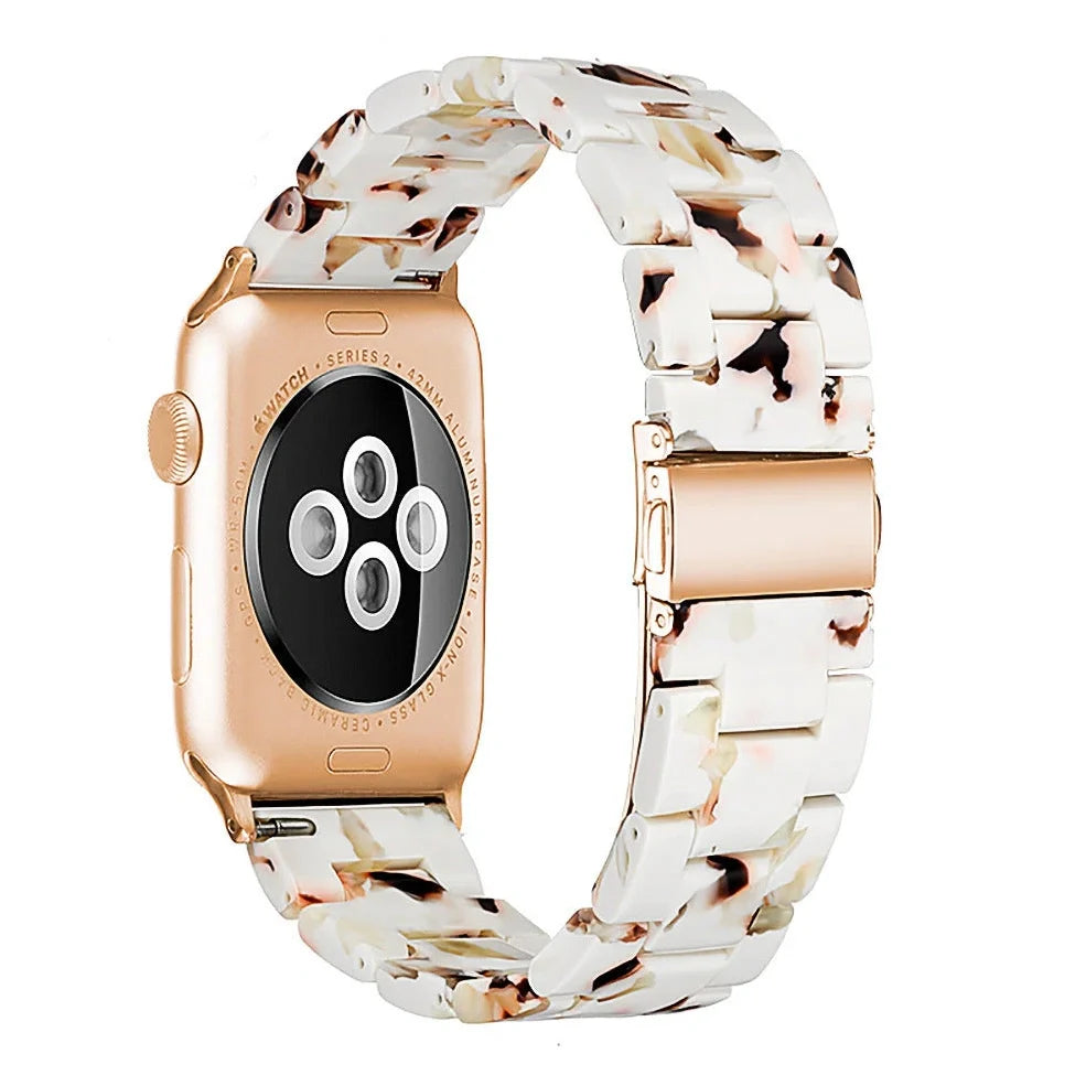 Slim resin Apple Watch strap showing attachment mechanism and colour options