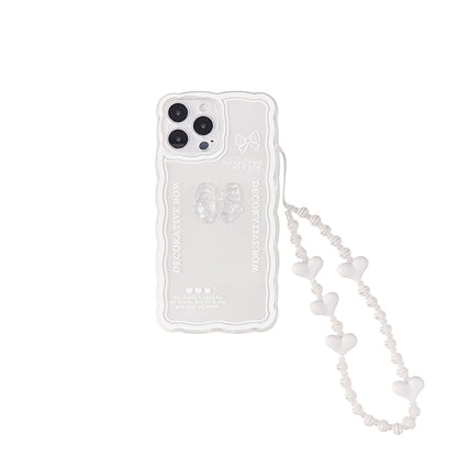 Transparent TPU iPhone case with 3D ice-through bow design on a mobile phone, showing optional white love lanyard attached.