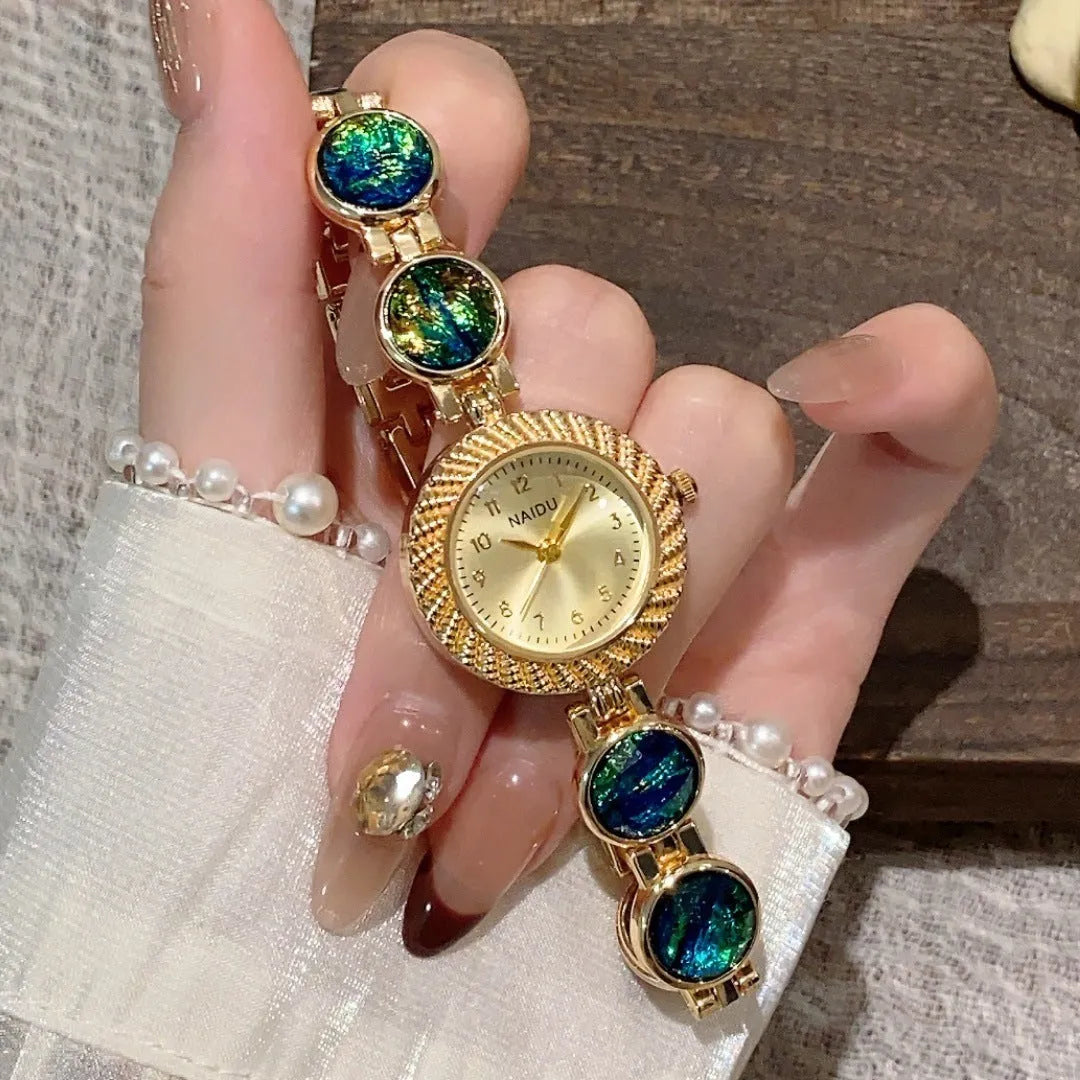 Women's quartz watch with 25mm round dial in milky white, on a zinc alloy case.