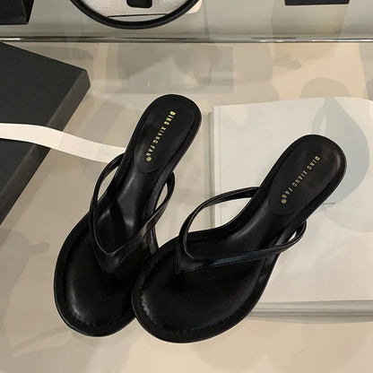 Women's open-toed stiletto sandals in rubber construction showing round toe design