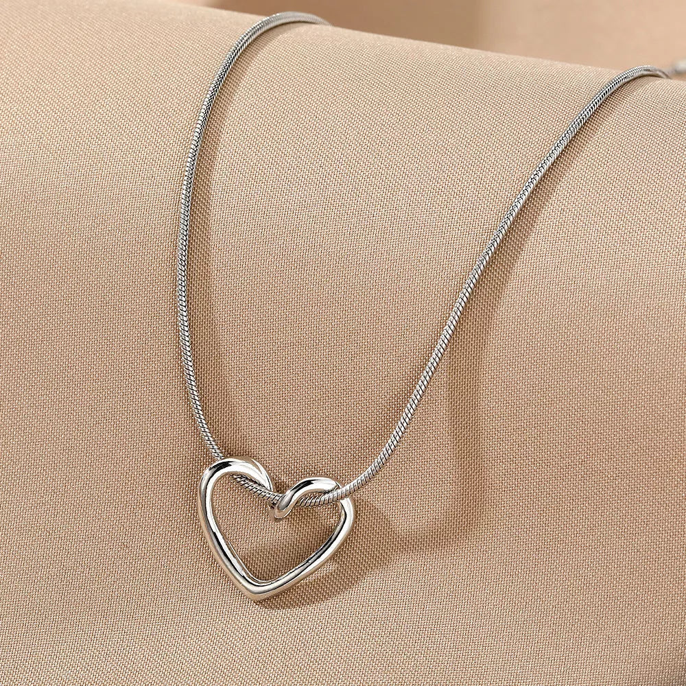 Niche Hollow Heart Necklace for women with snake bones chain and electroplated alloy