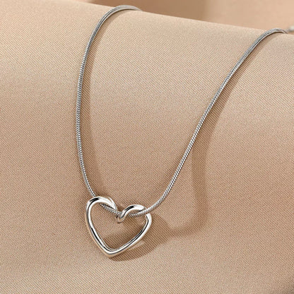 Niche Hollow Heart Necklace for women with snake bones chain and electroplated alloy