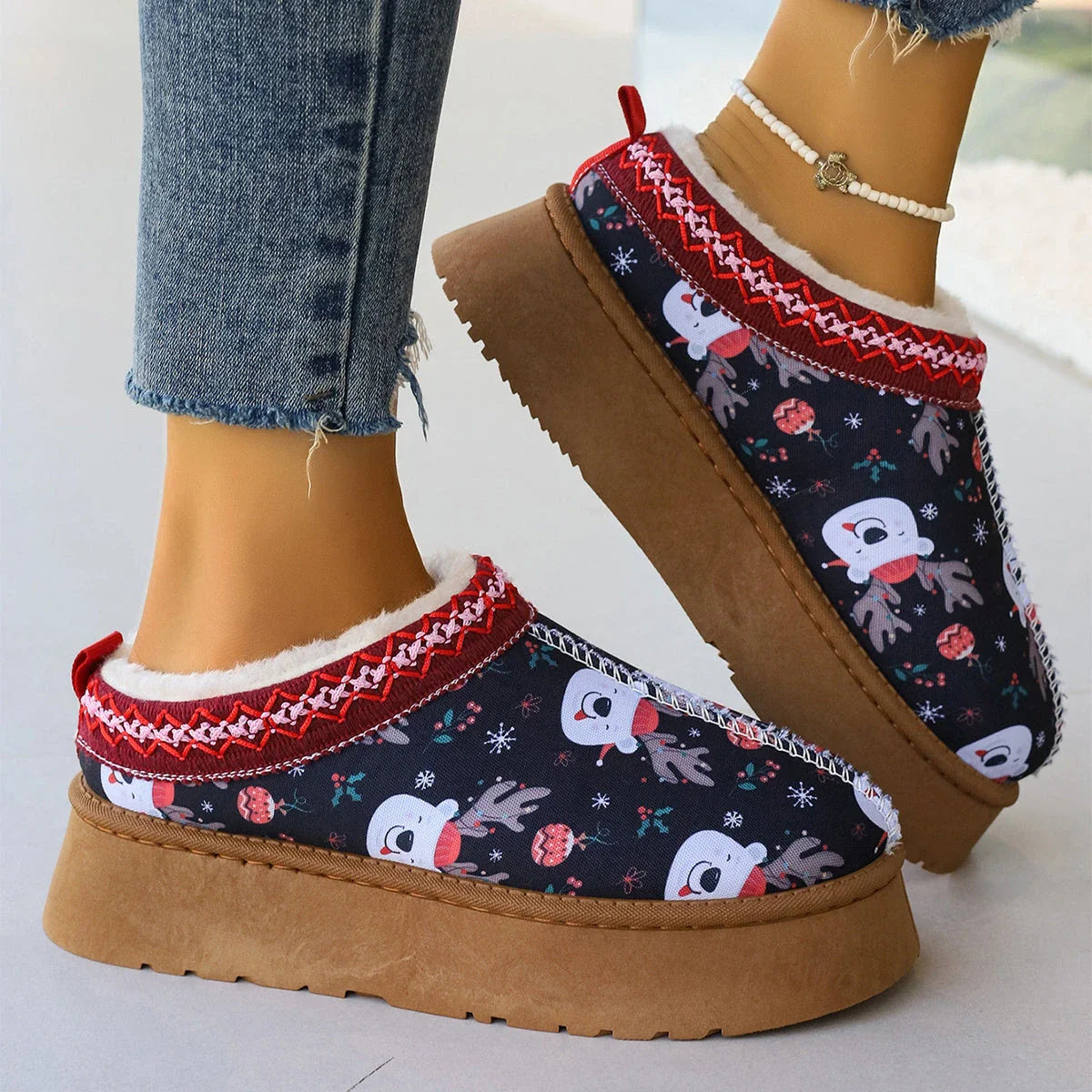 Women's winter ankle boots with festive cartoon Christmas print, plush lining, and durable EVA sole for comfortable, warm wear.