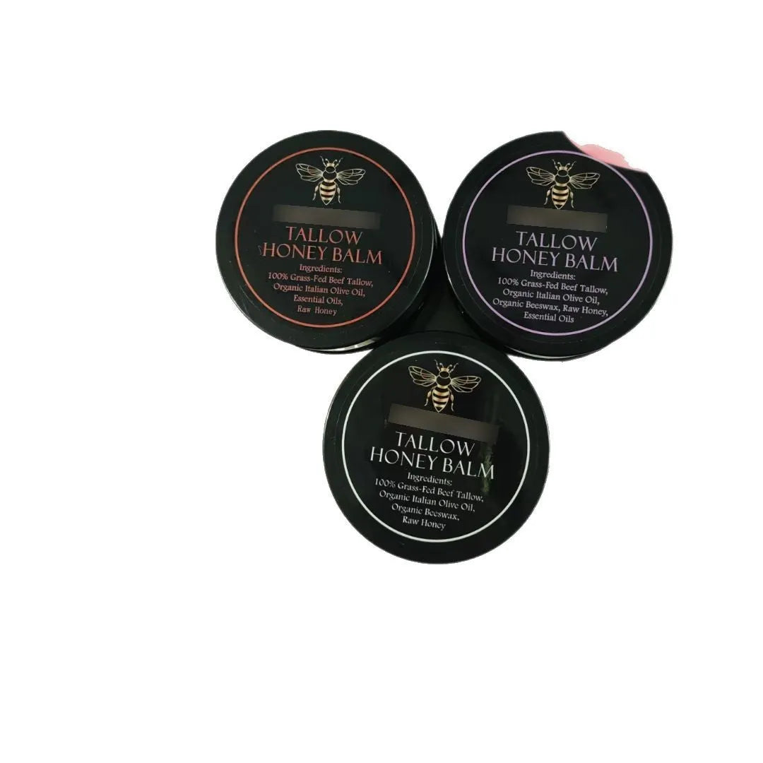 Glass jar of Honey Butter Moisturising Facial Cream with 57g net content label, shown with a dab of cream.