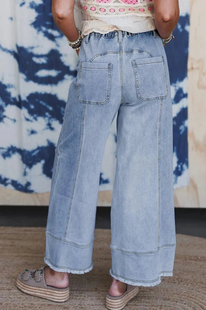 Beau Blue wide leg denim trousers with drawstring waist detail and raw hem finish