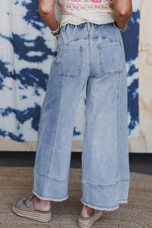 Beau Blue wide leg denim trousers with drawstring waist detail and raw hem finish