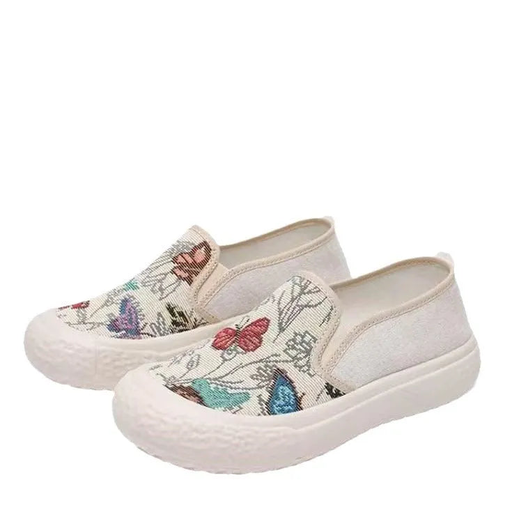 Women's classic canvas slip-on shoes with plastic soles in black and white colour options