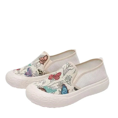 Women's classic canvas slip-on shoes with plastic soles in black and white colour options