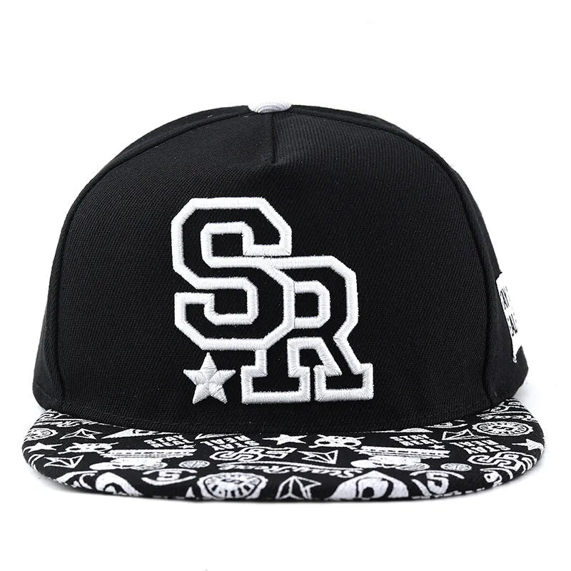 Cotton baseball hat with letter embroidery showing dome crown and adjustable strap in black and white colour options