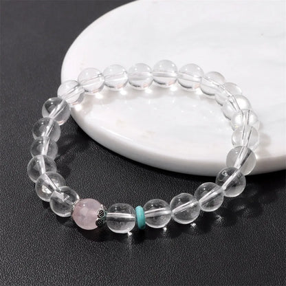 Handmade white crystal bracelet with 8mm beads and U-shaped design on wrist