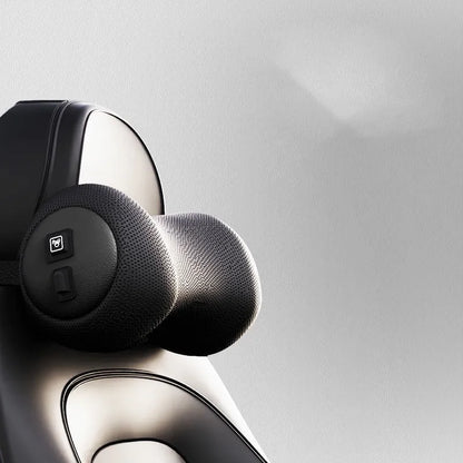 Black car massage cushion with adjustable straps attached to a car seat headrest