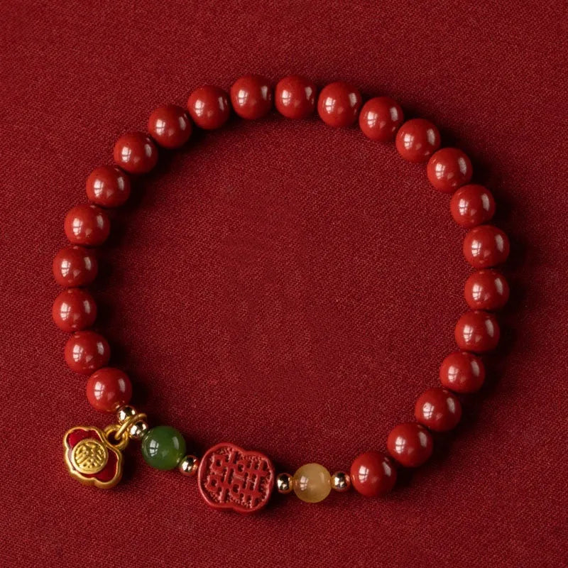 Emperor Sandstone bracelet with fu character, available in 6mm or 8mm cinnabar beads.