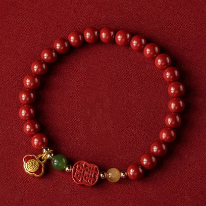 Emperor Sandstone bracelet with fu character, available in 6mm or 8mm cinnabar beads.