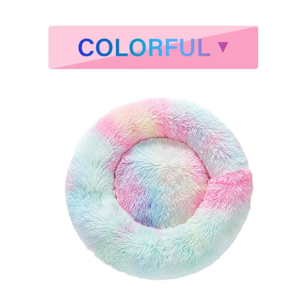 Fluffy donut-shaped dog bed in dark grey colour with raised edges, showing plush texture and circular design