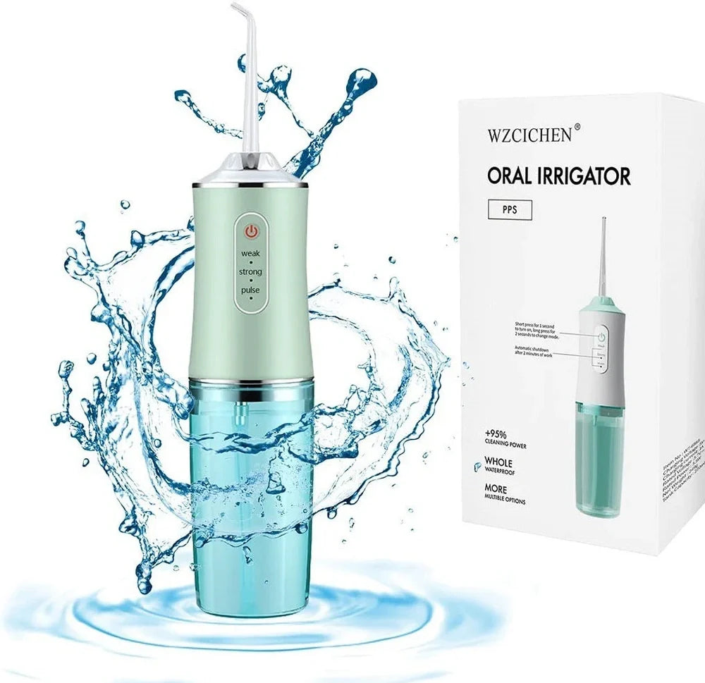 White oral irrigator with 4 nozzles showing water stream and USB charging port