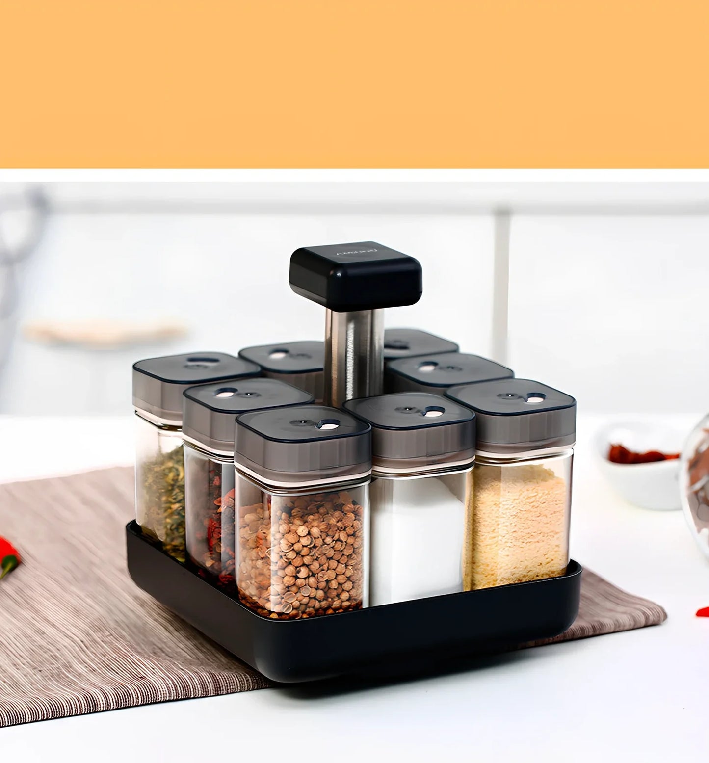 Six clear glass spice jars with natural bamboo lids in stackable configuration