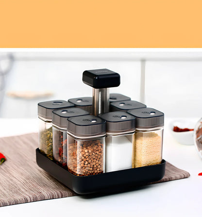 Six clear glass spice jars with natural bamboo lids in stackable configuration