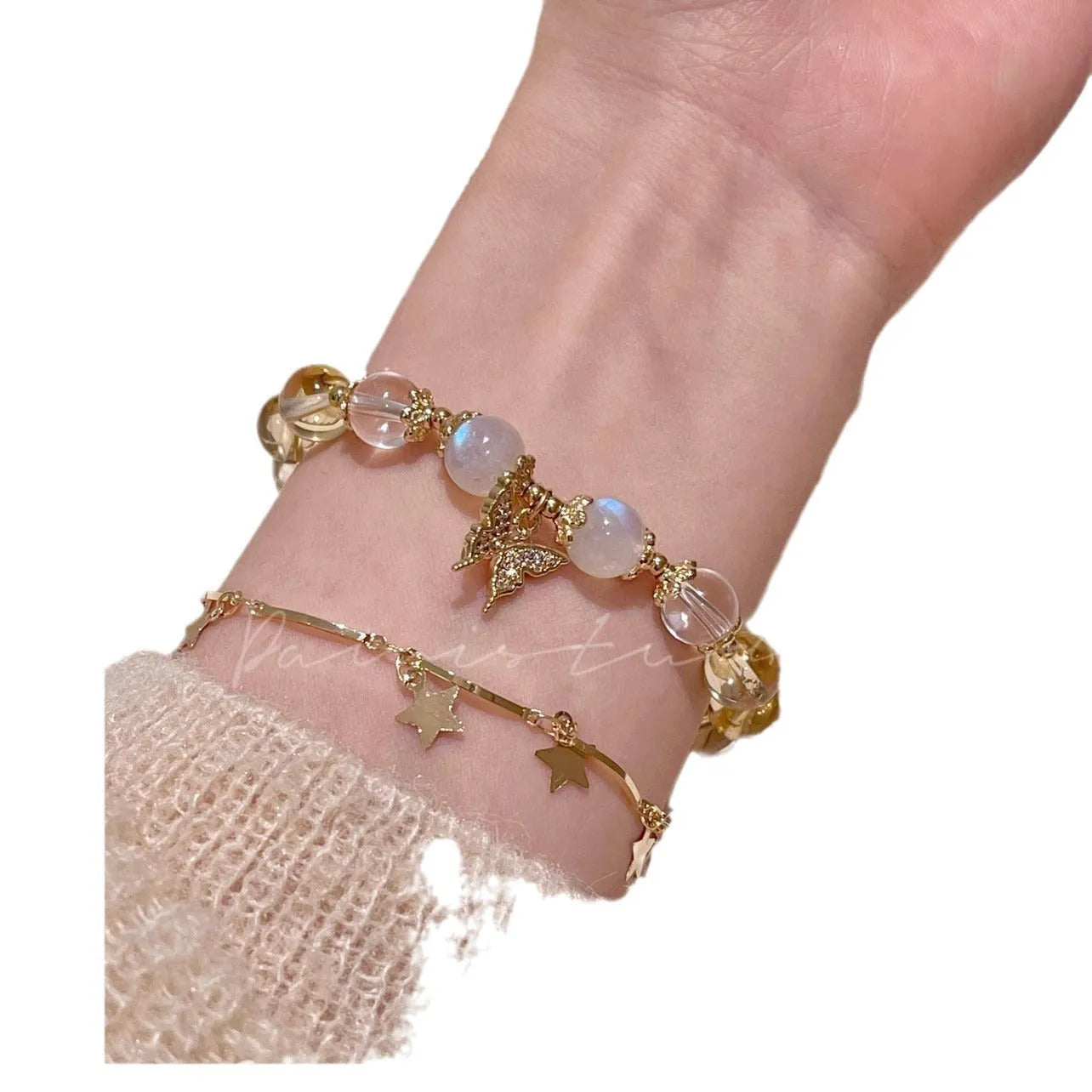 Chinese style white crystal beaded bracelet with citrine butterfly charm on adjustable string.