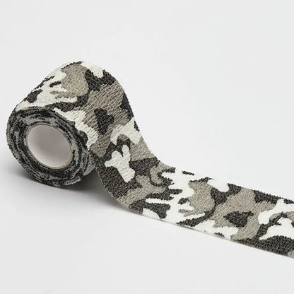 Roll of non-woven elastic camouflage bandage tape in a forest pattern, 4.5 metres long and 5cm wide.