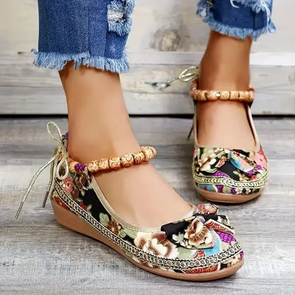Women's black plus size ethnic style platform sandals with elastic band and cloth upper.
