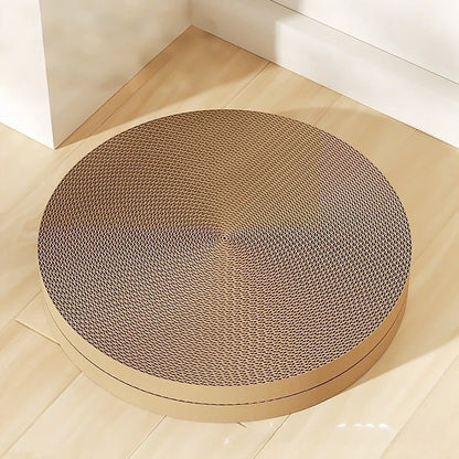 Green round cat scratching board measuring 55cm with corrugated paper surface and two replacement inserts