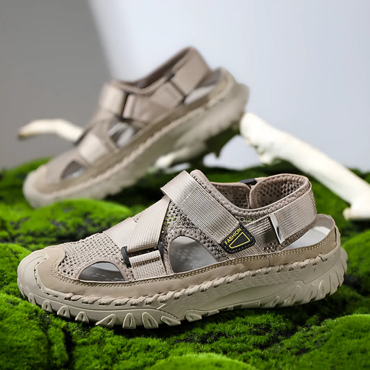 Men's grey casual sandals with hollow mesh upper, elastic band, and rubber sole.