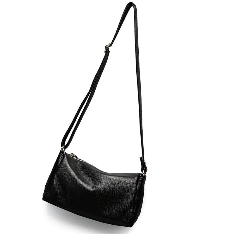 Soft genuine leather women's crossbody bag in horizontal square shape with single shoulder strap.