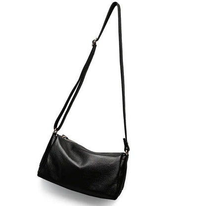 Soft genuine leather women's crossbody bag in horizontal square shape with single shoulder strap.