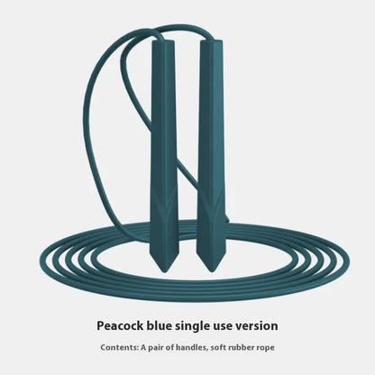 Blue PVC skipping rope with plastic handles on a grey background.