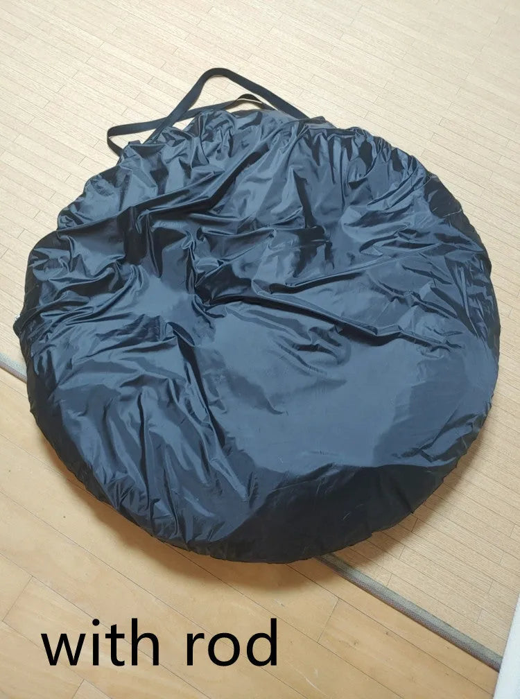 Black pop-up quick-throw car tail tent unfolded to a 200cm cube, set up behind an SUV.