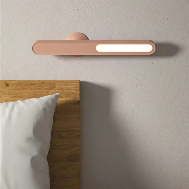 A modern, geometric desk lamp with wireless charging and a magnetic suction base for easy placement
