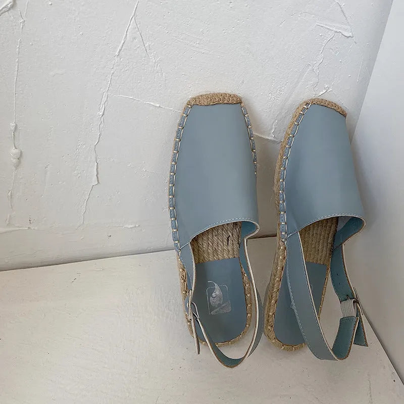 Women's beige retro fisherman flat sandals with animal pattern on canvas upper.