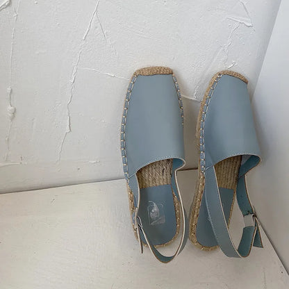 Women's beige retro fisherman flat sandals with animal pattern on canvas upper.