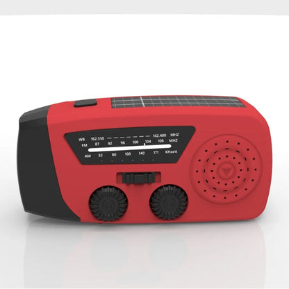 Red rechargeable hand radio with emergency torch, showing compact design with speaker grill and wrist strap attachment