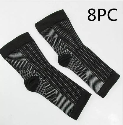 Anti-fatigue compression foot sleeves for men and women in black, red, and white