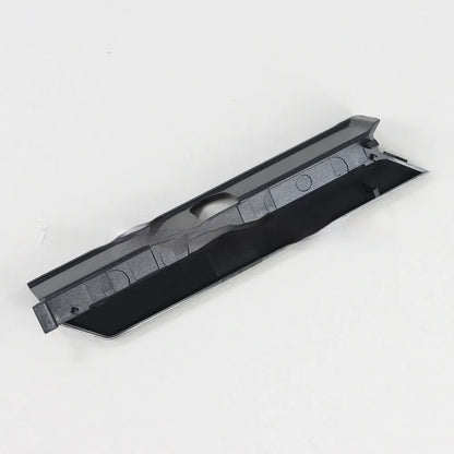Black polycarbonate hard drive cover with ventilation slots, shown installed in a PC's 5.25-inch bay.
