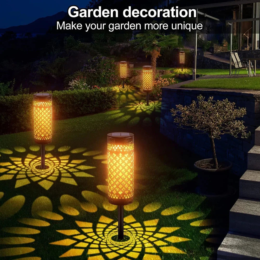 Geometric metal solar lawn lamp with warm white illumination in courtyard setting