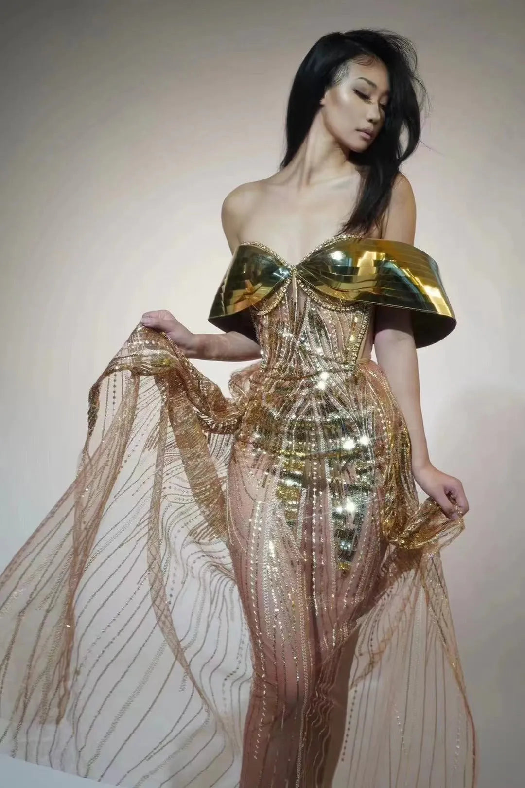 Gold strapless sequined tulle dress with thigh-high split and floor-length skirt
