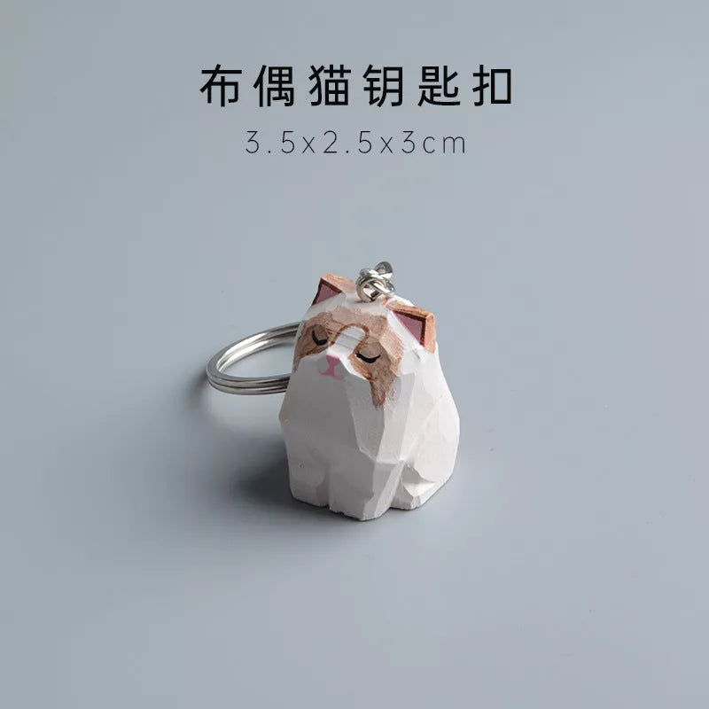 Handmade wooden cat trinkets in gray and orange, perfect for decor or gifts