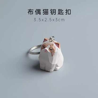 Handmade wooden cat trinkets in gray and orange, perfect for decor or gifts