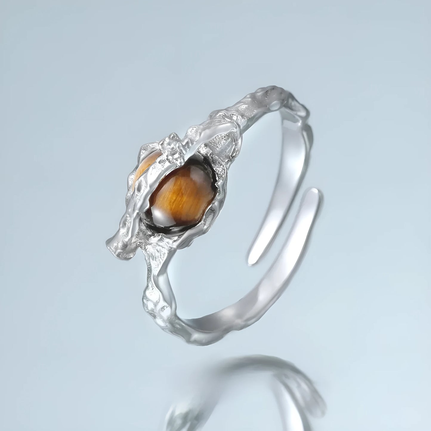 Silver saturn open ring with adjustable opening in white gold colour finish featuring tigereye design elements