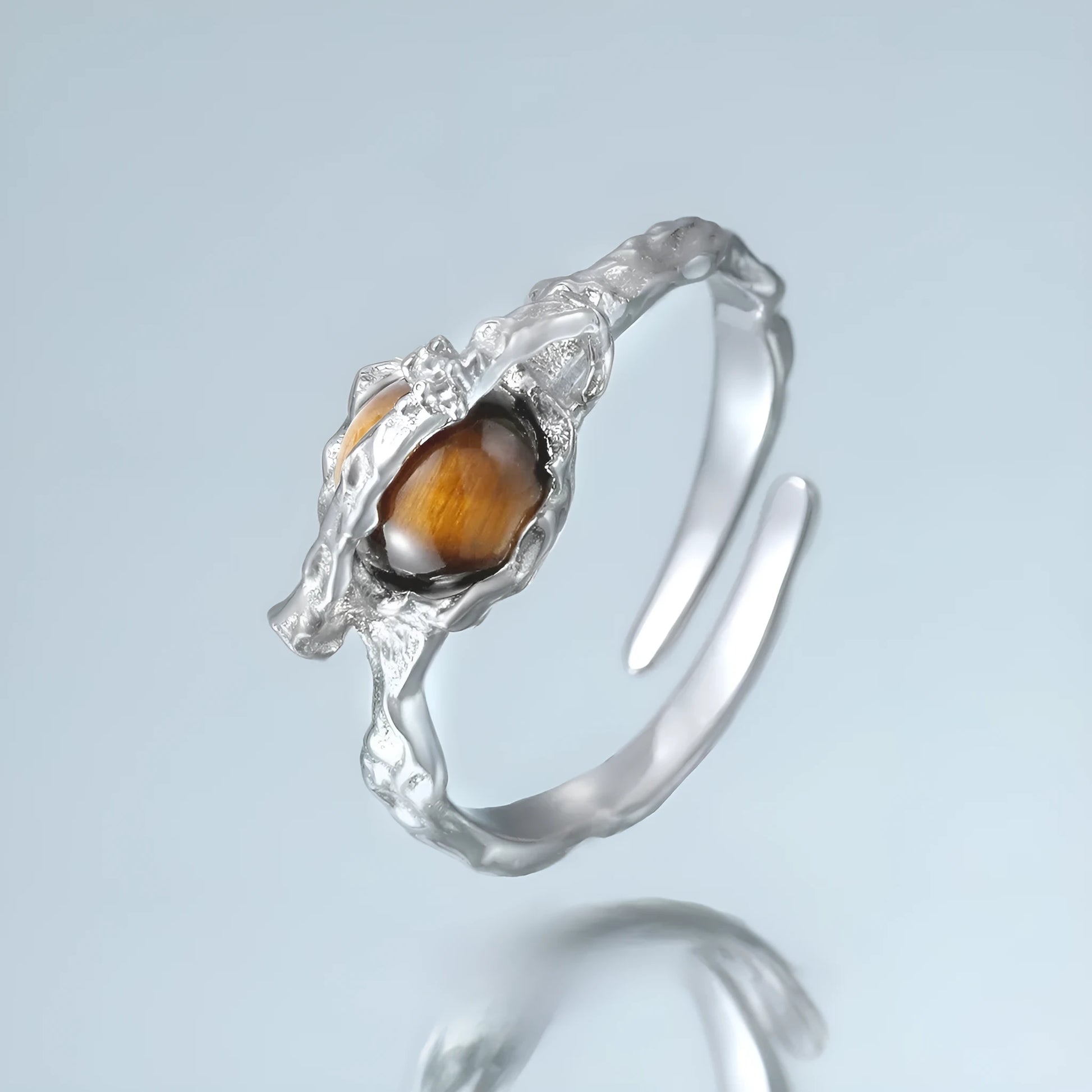 Silver saturn open ring with adjustable opening in white gold colour finish featuring tigereye design elements
