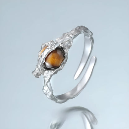 Silver saturn open ring with adjustable opening in white gold colour finish featuring tigereye design elements