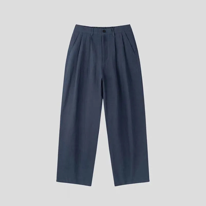 Men's apricot cotton linen trousers with elastic waistband and pencil leg opening on hanger