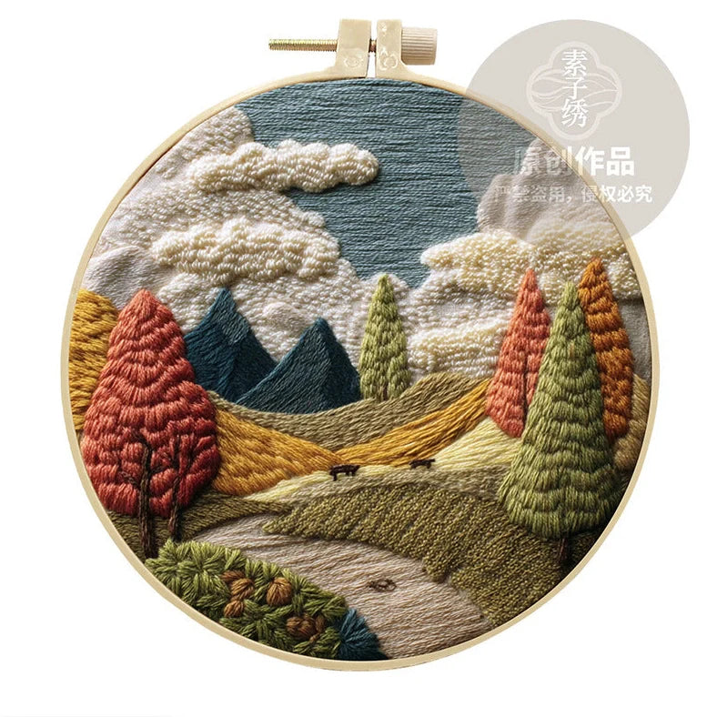 Embroidery DIY landscape kit with bamboo frame, printed fabric, thread, and needles for textile art