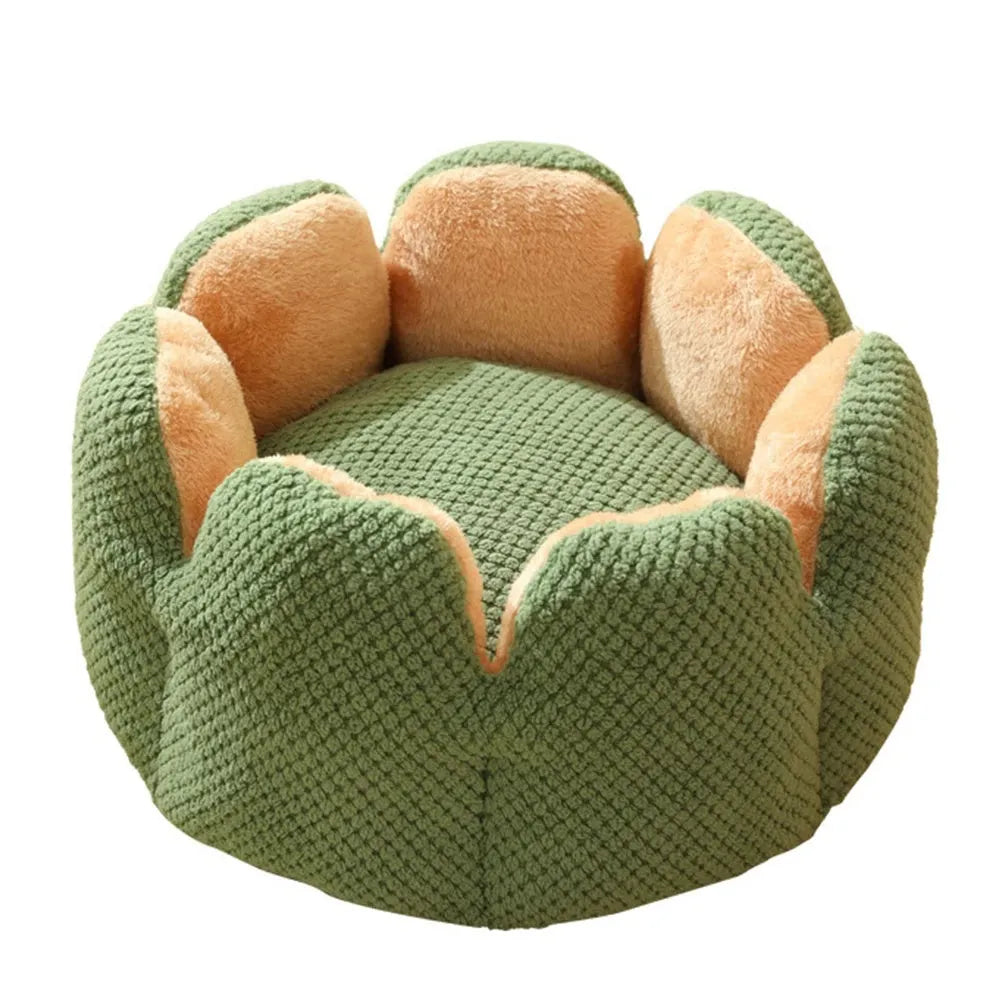 Green cactus petal shape pet bed for cats and dogs on a hardwood floor.