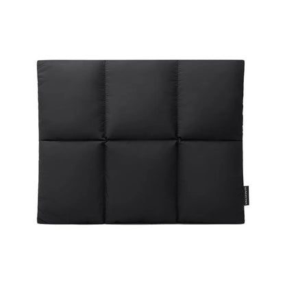 Soft black polyester laptop sleeve for a 15.6-inch laptop on a table.