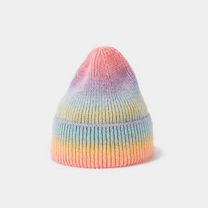 Gradient yarn knitted hat with tapered top in light blue colour showing knitted texture