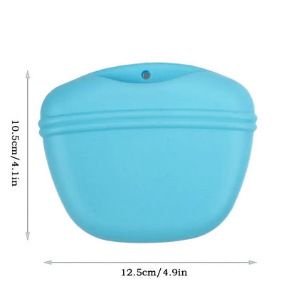 Black silicone dog training treat pouch with clip and magnetic closure shown attached to a belt.