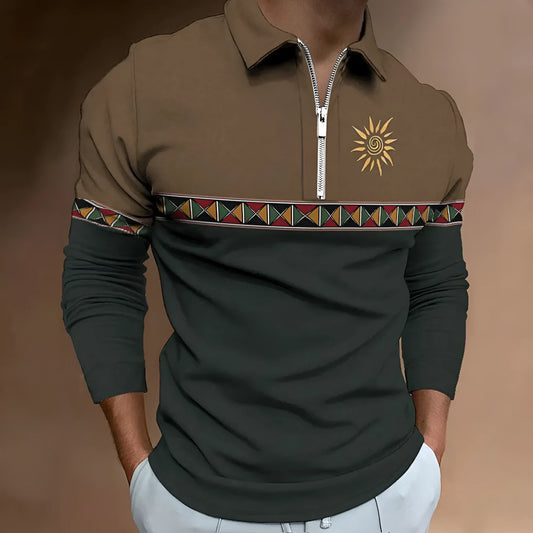 Man wearing a loose-fit long sleeve polo shirt with retro colour printing and a zip detail on the chest.